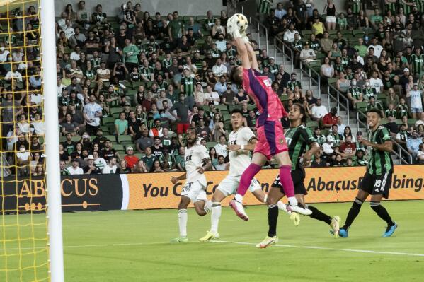 Los Angeles FC goalkeeper Tomas Romero goes up for a save during the first half of an MLS soccer match against Austin FC, Wednesday, Sept. 15, 2021, in Austin, Texas. (AP Photo/Michael Thomas)