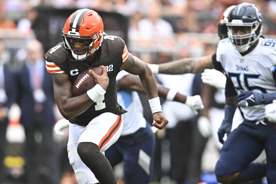Cleveland Browns quarterback Deshaun Watson (4) runs for a first down against the Tennessee Titans during the second half of an NFL football game Sunday, Sept. 24, 2023, in Cleveland. (AP Photo/David Richard)