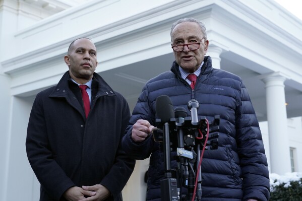 Senate Majority Leader Chuck Schumer of N.Y., right, standing next to House Minority Leader Hakeem Jeffries of N.Y., left, talks to reporters outside the West Wing of the White House in Washington, Wednesday, Jan. 17, 2024, following a meeting with President Joe Biden. (AP Photo/Susan Walsh)