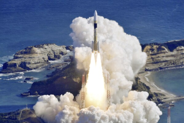 An H2A rocket is lifted from the launch pad at Tanegashima Space Center in Kagoshima, southern Japan Friday, Jan. 12, 2024. Japan on Friday launched the rocket carrying a government intelligence-gathering satellite on a mission to watch movements at military sites in North Korea and improve natural disaster response. (Kyodo News via AP)