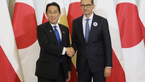Japan's Prime Minister Fumio Kishida, left, is greeted by his Polish host, Prime Minister Mateusz Morawiecki, right, ahead of their talks on regional security, war in Ukraine and bilateral cooperations in Warsaw, Poland, Tuesday, July 11, 2023. Kishida made a stop in Warsaw on his way to NATO summit in Vilnius, Lithuania. (AP Photo/Czarek Sokolowski)