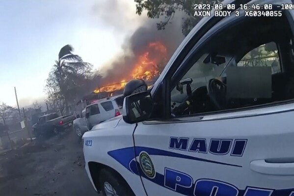 This image provided by Maui Police Department shows police body camera footage taken the day a wildfire tore through Lahaina town on Aug. 8, 2023. Maui police held a news conference on Monday, Oct. 30, 2023 to show 16 minutes of body camera footage taken the day a wildfire tore through Lahaina town. (Maui Police Department via AP)