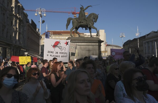 FILE - People attend a protest in solidarity with a woman who was denied an abortion despite her fetus having serious health problems, in Zagreb, Croatia, on May 12, 2022. In staunchly Catholic Croatia, influential conservative and religious groups have tried to get abortion banned but with no success. However, many doctors refuse to terminate pregnancies, forcing Croatian women to travel to neighboring countries for the procedure. (AP Photo, File)