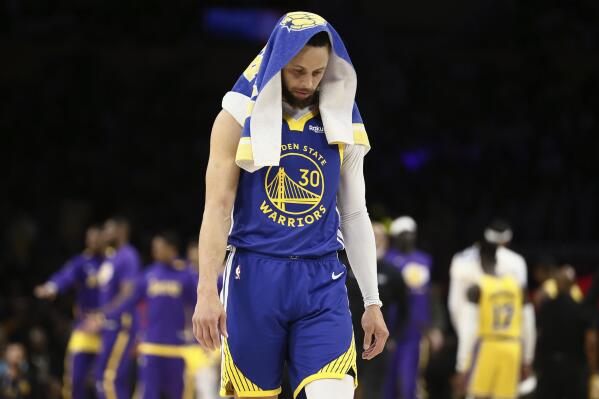 Golden State Warriors guard Stephen Curry stands during a timeout in the second quarter in Game 6 of the team's NBA basketball Western Conference semifinal against the Los Angeles Lakers on Friday, May 12, 2023, in Los Angeles. (Santiago Mejia/San Francisco Chronicle via AP)