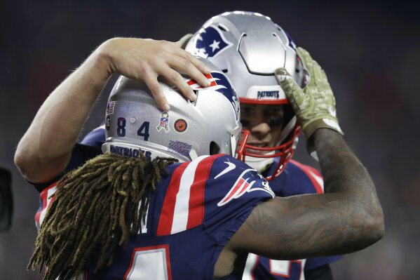 
              New England Patriots wide receiver Cordarrelle Patterson, left, celebrates his touchdown run with quarterback Tom Brady during the first half of an NFL football game against the Green Bay Packers, Sunday, Nov. 4, 2018, in Foxborough, Mass. (AP Photo/Charles Krupa)
            