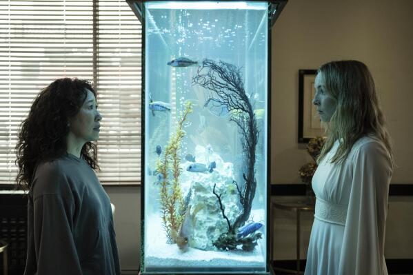 This image released by BBC America shows Sandra Oh, left, and Jodie Comer in a scene from the final season of "Killing Eve," premiering Sunday on BBC America and the AMC+ streaming service.  (Anika Molnar/BBC America via AP)
