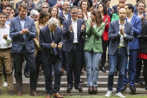 From left to right, leaders of France left-wing coalition for the upcoming election Green Party Yannick Jadot, Communist Party national secretary Fabien Roussel, Socialist Party Secretary General Olivier Faure President of the Green Party Marine Tondelier and Far-left Manuel Bompard applause as they pose for a group photo after a media conference in Paris, Friday, June 14, 2024. Leaders of France's left-wing parties, allied in a coalition known as the New Popular Front on Friday outlined their plan to fend off the far-right from claiming power at the upcoming snap national election. (AP Photo/Thomas Padilla) Socialist Party Secretary General Olivier Faure gestures a he speaks during a media conference for the upcoming election as far-left Manuel Bompard, Green Party Marine Tondelier, Green Party Yannick Jadot, and Communist Party national secretary Fabien Roussel