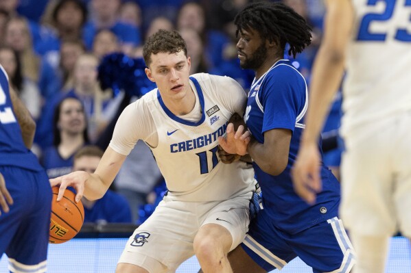 Creighton's Ryan Kalkbrenner, left, drives against Seton Hall's Jaden Bediako during the first half of an NCAA college basketball game Wednesday, Feb. 28, 2024, in Omaha, Neb. (AP Photo/Rebecca S. Gratz)