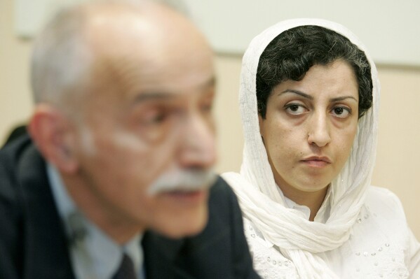 FILE - Iranian Narges Mohammadi, right, from the center for Human Rights Defenders, listens to Karim Lahidji, president of the Iranian league for the Defence of Human Rights, during a press conference on the Assessment of the Human Rights Situation in Iran, at the UN headquarters in Geneva, Switzerland, on June 9, 2008. The Nobel Peace Prize has been awarded to Narges Mohammadi for fighting oppression of women in Iran. The chair of the Norwegian Nobel Committee announced the prize Friday, Oct. 6, 2023 in Oslo. (Magali Girardin/Keystone via AP, File)