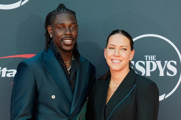 NBA basketball player Jrue Holiday, left, and former professional soccer player Lauren Holiday arrive at the ESPY awards on Wednesday, July 12, 2023, at the Dolby Theatre in Los Angeles. (AP Photo/Chris Pizzello, File)