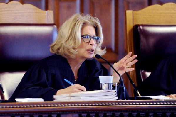 FILE — New York Court of Appeals Chief Judge Janet DiFiore, asks questions during oral arguments at the Court of Appeals, June 1, 2016, in Albany, N.Y. Di Fiore announced Monday, July 11, 2022, she will step down after more than six years presiding at the state's highest court and overseeing the state court system. (AP Photo/Hans Pennink, File)