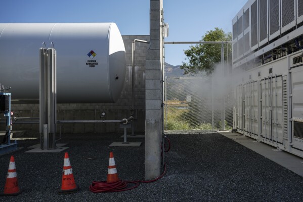 A tank that holds liquid hydrogen, left, which is converted to gas to run the fuel cells, sits at at Energy Vault, a company that is creating an emergency power system that relies on hydrogen and battery storage, on Tuesday, May 27, 2025, in Calistoga, Calif. (AP Photo/Annika Hammerschlag)