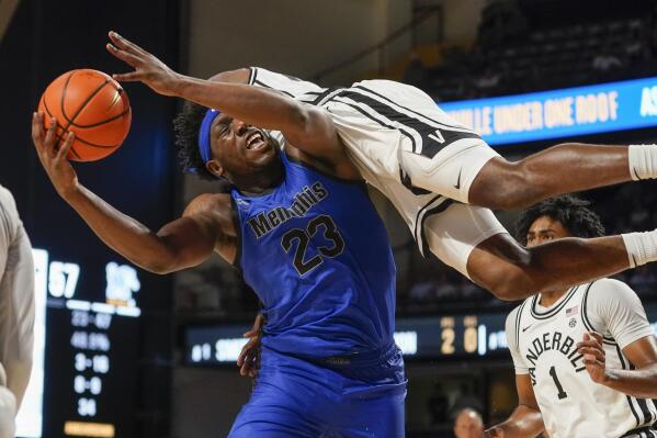 Memphis forward Malcolm Dandridge (23) is hit by Vanderbilt forward Emmanuel Ansong in the second half of an NCAA college basketball game Monday, Nov. 7, 2022, in Nashville, Tenn. (AP Photo/Mark Humphrey)