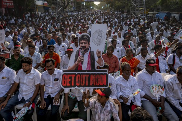 A boy holds a placard at a rally for Dravida Munnetra Kazhagam party leader and Chief Minister of Tamil Nadu state, M. K. Stalin, in the southern Indian city of Chennai, April 17, 2024. (AP Photo/Altaf Qadri)