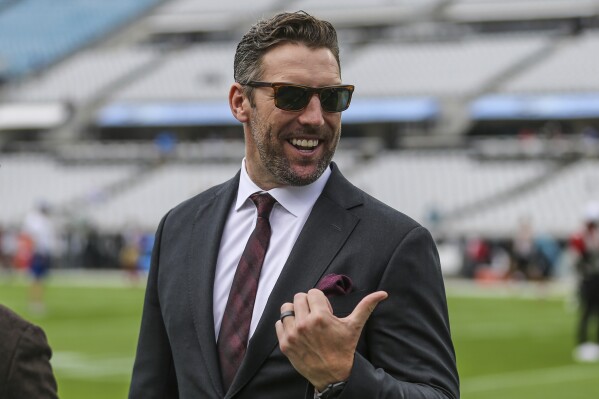 FILE - San Francisco assistant general manager Adam Peters walks the sideline during warm-ups before an NFL football game against the Jacksonville Jaguars, Sunday, Nov. 21, 2021, in Jacksonville, Fla. The Washington Commanders have an agreement in place to hire San Francisco 49ers assistant general manager Adam Peters as their new head of football operations, according to a person with knowledge of the move. The person spoke to The Associated Press on condition of anonymity Friday, Jan. 12, 2024, because the team had not yet announced the hire.(AP Photo/Gary McCullough, File)