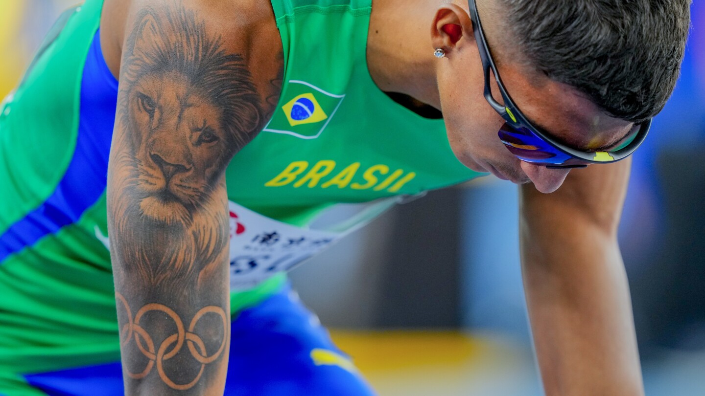 Athletes showcase tattoos of Olympic rings, lions and superheroes at World ...