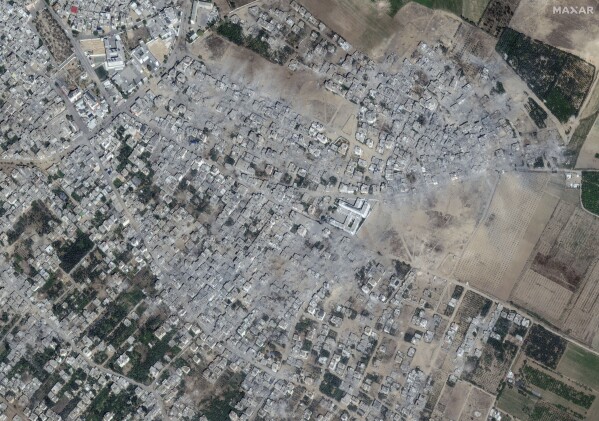 This image provided by Maxar Technologies shows damage to buildings and structures in the neighborhood after bombing at Beit Hanoun, northern Gaza, Oct. 21, 2023. (Satellite image ©2023 Maxar Technologies via AP)