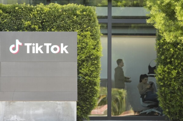 People work inside the TikTok Inc. building in Culver City, Calif., Monday, March 11, 2024. House Republicans are moving ahead with a bill that would require Chinese company ByteDance to sell TikTok or face a ban in the United States even as President Donald Trump is voicing opposition to the effort. (AP Photo/Damian Dovarganes)