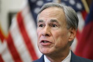 FILE - In this June 8, 2021, file photo, Texas Gov. Greg Abbott speaks at a news conference in Austin, Texas. Opponents of a sweeping Republican elections overhaul in Texas sued Gov. Greg Abbott on Friday, Sept. 3, 2021 going to court even before he had signed into law changes that would further tighten the state's already strict voting rules. (AP Photo/Eric Gay, File)