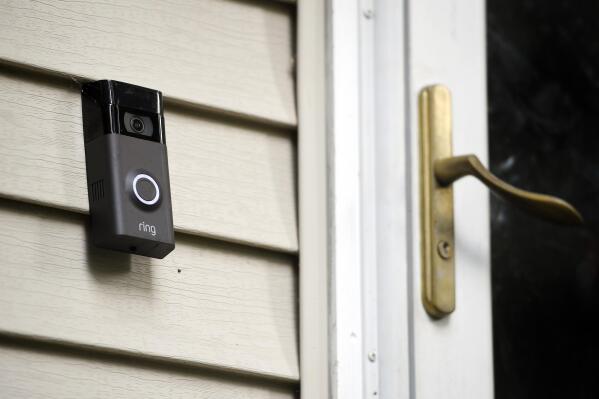 FILE - a Ring doorbell camera is seen installed outside a home in Wolcott, Conn., on July 16, 2019. Amazon has provided Ring doorbell footage to law enforcement 11 times this year without the user’s permission, a revelation that’s bound to raise more privacy and civil liberty concerns about its video-sharing agreements with police departments across the country. The disclosure came in a letter from the company that was made public Wednesday, July 13, 2022, by U.S. Sen. Edward Markey, D-Mass.  (AP Photo/Jessica Hill, File)