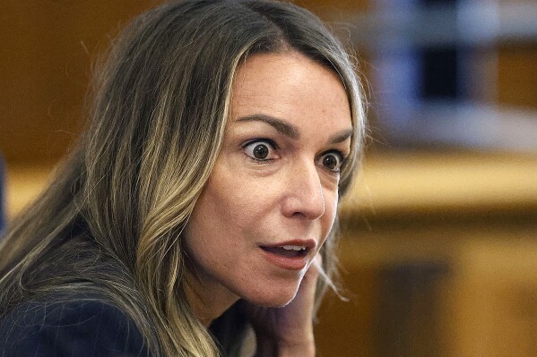Karen Read reacts to he attorney Alan Jackson as he cross examines state trooper Michael Proctor during her trial, Wednesday, June 12, 2024, in Norfolk Super Court in Dedham, Mass. Read is facing charges, including second degree murder, in the 2022 death of her boyfriend Boston Officer John O’Keefe. (Greg Derr/The Patriot Ledger via AP, Pool)