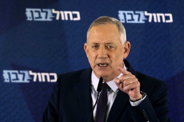 FILE - In this Saturday, March 7, 2020 file photo, Blue and White party leader Benny Gantz delivers a statement in Tel Aviv, Israel. Israel's President Reuven Rivlin on Sunday, March 15 said he has decided to give Gantz the first opportunity to form a new government following an inconclusive national election this month. Rivlin's office announced his decision late Sunday after consulting with leaders of all of the parties elected to parliament. (AP Photo/Sebastian Scheiner, File)