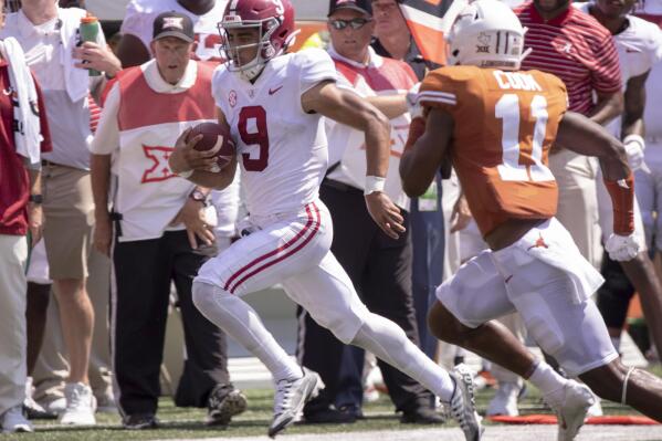 Alabama quarterback Bryce Young (9) is chased out of bounds by Texas defensive back Anthony Cook during the second half of an NCAA college football game, Saturday, Sept. 10, 2022, in Austin, Texas. Alabama defeated Texas 20-19. (AP Photo/Rodolfo Gonzalez)