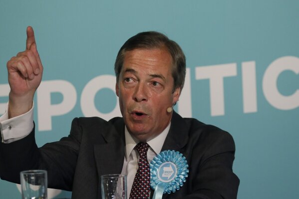 
              British Politician Nigel Farage speaks on stage during a Brexit Party rally at Lakeside Country Club in Frimley Green in Surrey, England, Sunday, May 19, 2019. No one in Britain is more enthusiastic about this week’s European Union elections than people who hate the EU. Hard-core Brexit supporters are chomping at the bit to cast ballots for populist politician Nigel Farage’s Brexit Party, whose sole policy is to leave the EU as soon as possible. Three years after Britain narrowly voted to leave the EU, Thursday’s election is seen by many as a proxy referendum on Brexit. (AP Photo/Kirsty Wigglesworth)
            