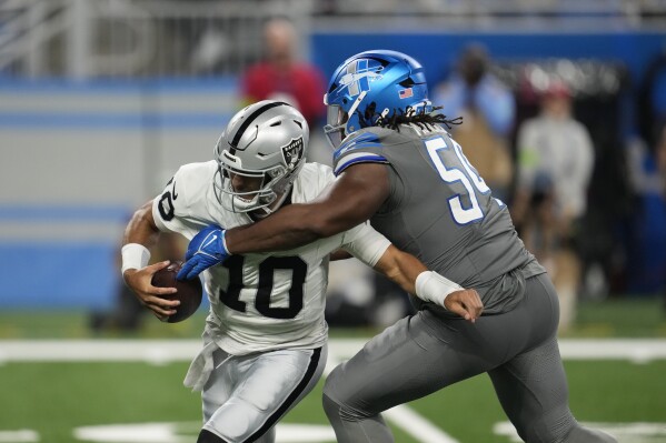 Detroit Lions defensive tackle Alim McNeill (54) sacks Las Vegas Raiders quarterback Jimmy Garoppolo (10) during the second half of an NFL football game, Monday, Oct. 30, 2023, in Detroit. (AP Photo/Paul Sancya)