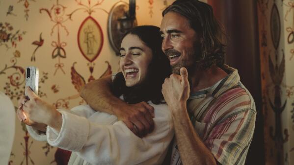 This image released by A24 shows Rachel Sennott, left, and Lee Pace in a scene from "Bodies Bodies Bodies." (A24 via AP)