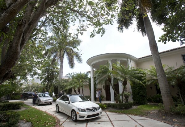 FILE - The exterior of a South Florida home that once belonged to 1970's heartthrob David Cassidy appears in Fort Lauderdale, Fla. on July 22, 2015. The home has been sold for $2.6 million. Cassidy rose to fame as a teen idol who starred in "The Partridge Family." He died at age 67 in 2017. (AP Photo/Wilfredo Lee, File)