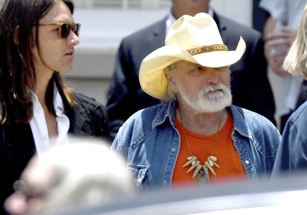 FILE - Dickey Betts a founding member of the Allman Brothers Band exits the funeral of Gregg Allman at Snows Memorial Chapel June 3 2017 in Macon Ga Guitar legend Betts who co-founded the Allman Brothers Band and wrote their biggest hit Ramblin Man died Thursday April 18 2024 He was 80 Jason VorheesThe Macon Telegraph via AP File
