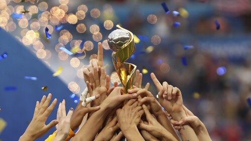 FILE - Players of the United States hold the trophy as they celebrate winning the Women's World Cup final soccer match against the Netherlands at the Stade de Lyon in Decines, on the outskirts of Lyon, France, July 17, 2019. more prize money than ever at this year's Women's World Cup, and the players will receive direct payments from FIFA this time.  (AP Photo/Francisco Seco, File)