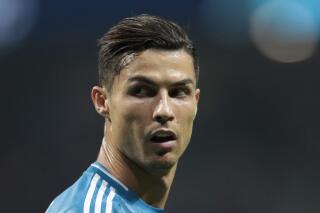 FILE - In this Sept. 18, 2019, file photo, Juventus' Cristiano Ronaldo looks back during a Champions League Group D soccer match in Madrid, Spain. More than a decade after the soccer star paid $375,000 to hush a Nevada woman's claim that he raped her in Las Vegas, new allegations about cyber hacking, document theft and attorney misconduct are being raised to block the woman's bid for more money. (AP Photo/Bernat Armangue, File)