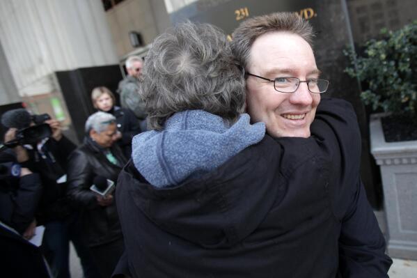 Helen Vigil hugs Michael David Meeks after being acquitted of charges connected to the Hutaree Militia at the Theodore Levin U.S. courthouse in Detroit on Tuesday, March 27, 2012. A federal judge on Tuesday gutted the government's case against seven members of a U.S. militia, dismissing the most serious charges in an extraordinary defeat for federal authorities who insisted they had captured homegrown rural extremists poised for war. (AP Photo/Detroit Free Press, Kimberly P. Mitchell)  DETROIT NEWS OUT; TV OUT; INTERNET OUT; MAGS OUT; NO SALES; MANDATORY CREDIT