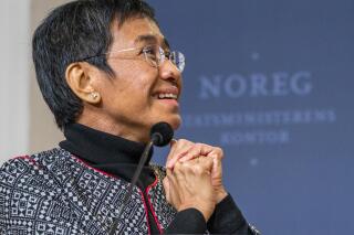 FILE - Nobel Peace Prize laureate Maria Ressa, from the Philippines, attends a news conference in Oslo, Saturday, Dec. 11, 2021. Ressa announced in a speech in Hawaii, Tuesday, June 28, 2022, that the Philippine government is affirming a previous order to shut down Rappler, the news website she co-founded, which has gained notoriety for its reporting of President Rodrigo Duterte's bloody crackdown on illegal drugs. (Hakon Mosvold Larsen/NTB scanpix via AP, File)
