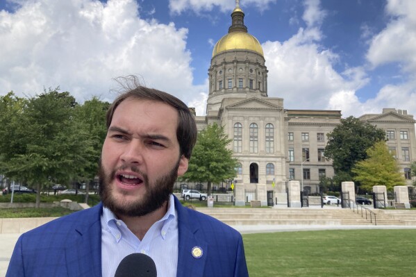 FILE - Georgia state Sen. Colton Moore, R-Trenton, speaks to reporters outside the Georgia Capitol in Atlanta, Sept. 7, 2023. Georgia House Speaker Jon Burns, R-Newington, banned Moore from the House floor on Thursday, March 14, 2024 after Moore attacked late House Speaker David Ralston as "corrupt" in a speech as both the House and Senate were honoring Ralston. (AP Photo/Jeff Amy, File)