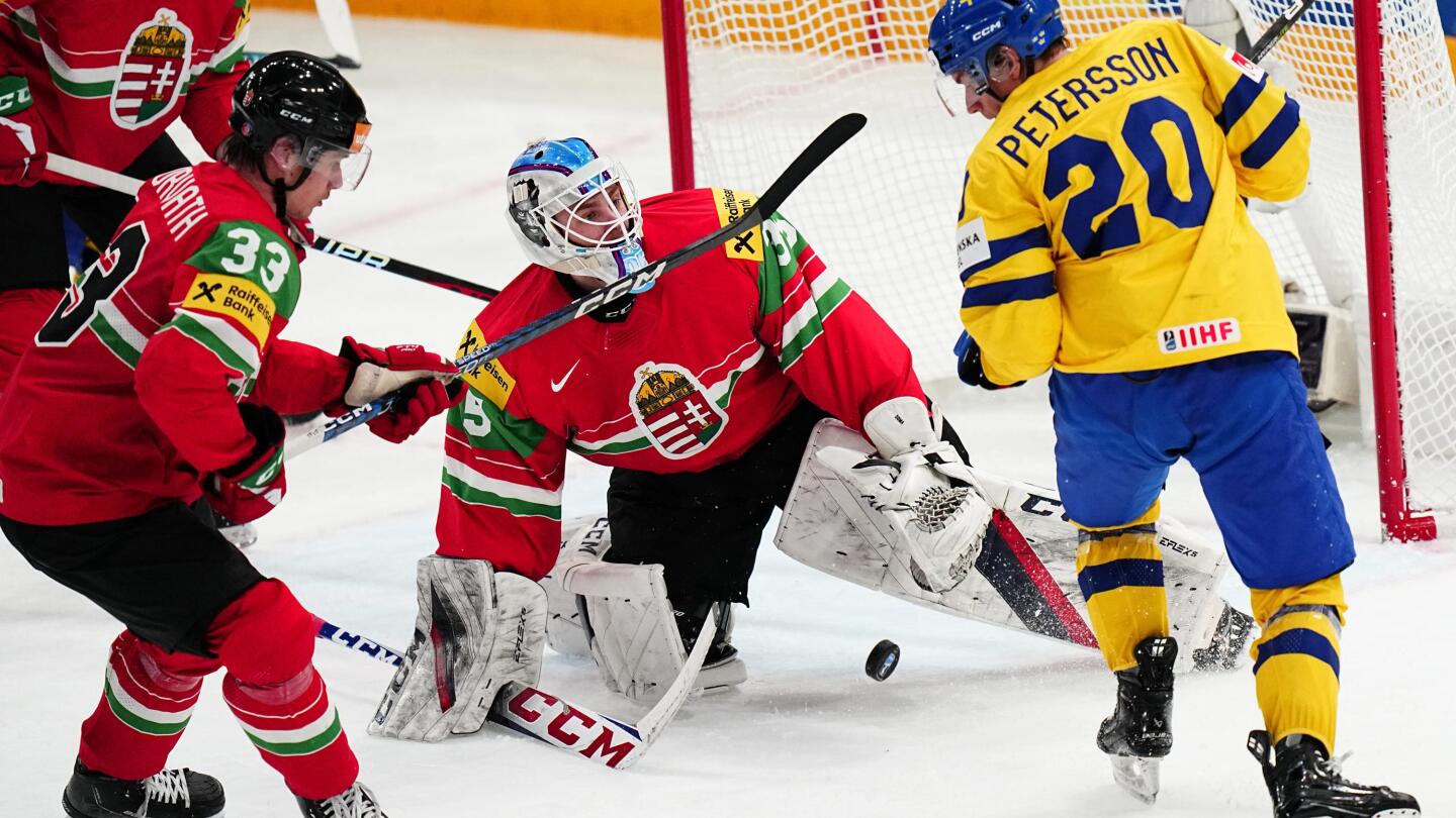 Schweden besiegte Ungarn mit 7:1 und die Schweiz besiegte die Slowakei mit 4:2 bei den Eishockey-Weltmeisterschaften Schweden besiegte Ungarn mit 7:1 und die Schweiz besiegte die Slowakei mit 4:2 bei den Eishockey-Weltmeisterschaften