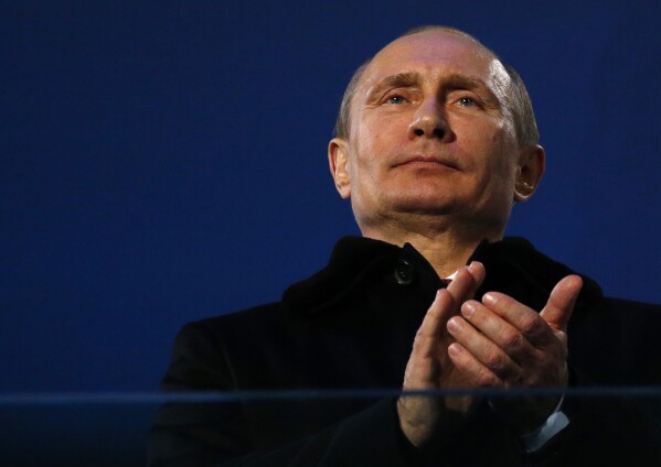 FILE - Russian President Vladimir Putin attends the closing ceremony of the 2014 Winter Paralympics at the Fisht Olympic stadium in Sochi, Russia, Sunday, March 16, 2014. The Sochi Games were the most expensive in Olympics history. (AP Photo/Dmitry Lovetsky, File)