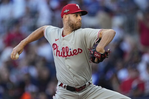 FILE - Philadelphia Phillies starting pitcher Zack Wheeler (45) works from the mound in the first inning of Game 2 of a baseball NL Division Series against the Atlanta Braves, Monday, Oct. 9, 2023, in Atlanta. The Philadelphia Phillies have agreed with ace Zack Wheeler on a three-year contract worth a reported $126 million, and his $42 million average salary would be the highest in franchise history. The Phillies announced that Wheeler had agreed to the new deal Monday, March 4, 2024.(AP Photo/John Bazemore, File)