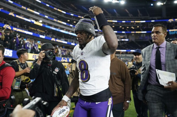 Baltimore Ravens quarterback Lamar Jackson (8) walks off the field after a win over the Los Angeles Chargers in an NFL football game Sunday, Nov. 26, 2023, in Inglewood, Calif. (AP Photo/Ryan Sun)