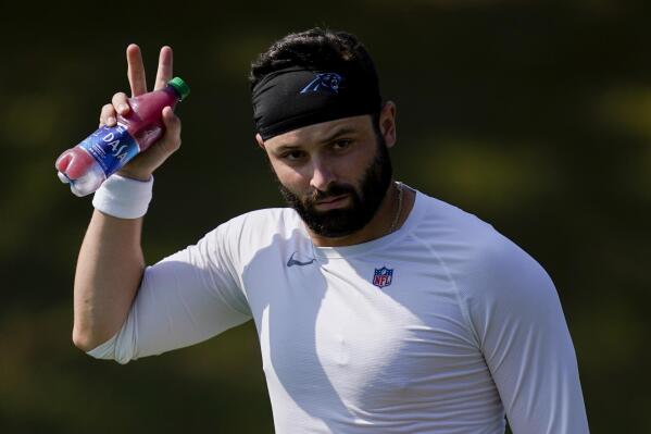 FILE - Carolina Panthers' Baker Mayfield arrives for the NFL football team's training camp at Wofford College on Tuesday, Aug. 2, 2022, in Spartanburg, S.C. Two weeks into training camp and the battle for the Carolina Panthers starting quarterback remains undecided with Baker Mayfield and Sam Darnold competing for the job. (AP Photo/Chris Carlson, File)