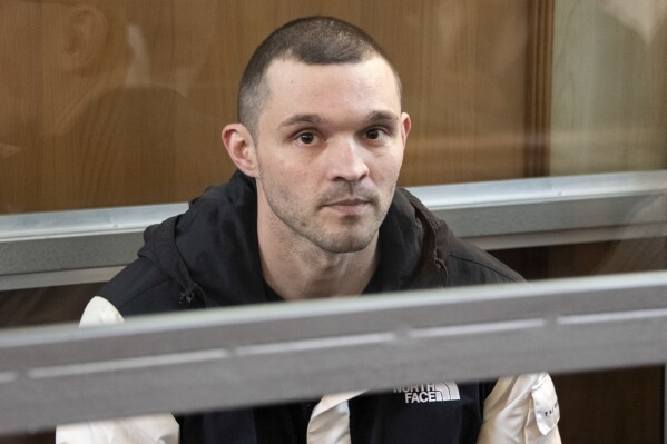 U.S. Army Staff Sgt. Gordon Black sits in a glass cage in courtroom in Vladivostok, Russia, Thursday, June 6, 2024. A court in Russia's far eastern city of Vladivostok on Thursday began the trial of an American soldier arrested in the city earlier this year on charges of stealing. He faces up to five years in prison if convicted. (AP Photo/)
