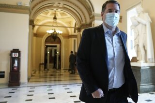FILE - In this Wednesday, Jan. 13, 2021, file photo, Rep. Devin Nunes, R-Calif., walks at the Capitol in Washington, as the House of Representatives pursues an article of impeachment against President Donald Trump for his role in inciting an angry mob to storm the Capitol last week. A defamation lawsuit Rep. Nunes brought against CNN was tossed out by a Manhattan judge on Friday, Feb. 19. The lawsuit seeking over $435 million in damages was rejected by U.S. District Judge Laura Taylor Swain, who said the California Republican failed to request a retraction in a timely fashion or adequately state his claims. (AP Photo/J. Scott Applewhite, File)