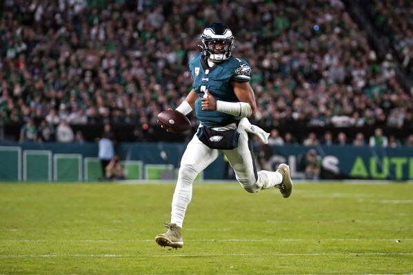 Philadelphia Eagles quarterback Jalen Hurts (1) runs with the ball during the second half of an NFL football game against the Dallas Cowboys on Sunday, Nov. 5, 2023, in Philadelphia. (AP Photo/Matt Slocum)
