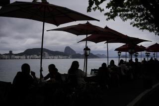 FILE - People have brunch at the Copacabana Fort in Rio de Janeiro, Brazil, Tuesday, Oct. 4, 2022. Brazil is reintroducing the requirement for tourist visas for citizens of the U.S., Australia, Canada, and Japan effective from Oct. 1, 2023, the foreign ministry said. (AP Photo/Matias Delacroix, File)