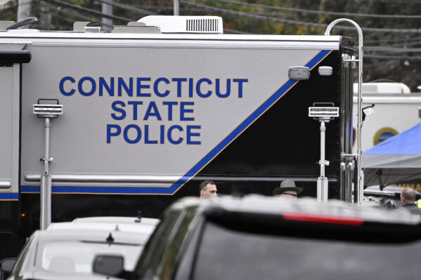 FILE — Members of the Connecticut State Police Major Crime unit are on scene, Oct. 13, 2022, in Bristol, Conn. A judge has rejected a bid by the Connecticut State Police Union, Thursday, Sept. 7, 2023, to temporarily keep secret the names of 130 state police troopers under investigation for allegedly recording bogus traffic stops, but says it will get another chance.(AP Photo/Jessica Hill, File)