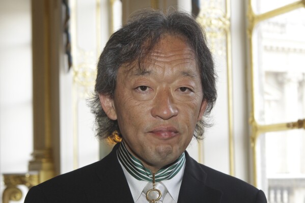 South Korean conductor and pianist Myung-whun Chung poses for a photographer after being awarded with the Commander of Arts and Letters medal in Paris, on June 29, 2009. (AP Photo/Michel Euler, File)