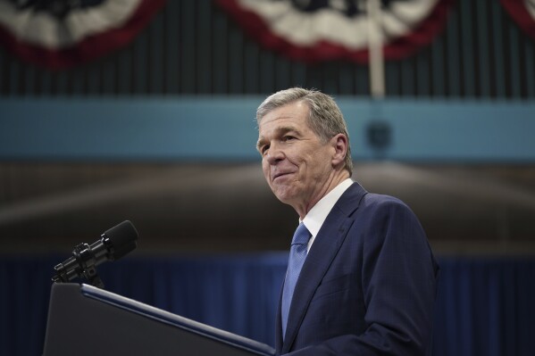 FILE - North Carolina Gov. Roy Cooper, D-N.C., delivers remarks during a campaign event in Raleigh, N.C., March 26, 2024. The North Carolina General Assembly begins its annual work session Wednesday, April 24, with a little extra money to spend and limited pressing issues to address before key elections this fall and longtime state government leaders depart. (AP Photo/Stephanie Scarbrough, file)