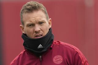 This Oct. 19, 2021 taken photo shows Julian Nagelsmann, head coach of German soccer club Bayern Munich during a training session for the Champions League group E soccer match between Benfica and Bayern Munich. Nagelsmann has tested positive for the coronavirus despite being fully vaccinated. He will return to Munich separately from the team by ambulance plane and will be placed in domestic isolation. (AP Photo/Matthias Schrader)
